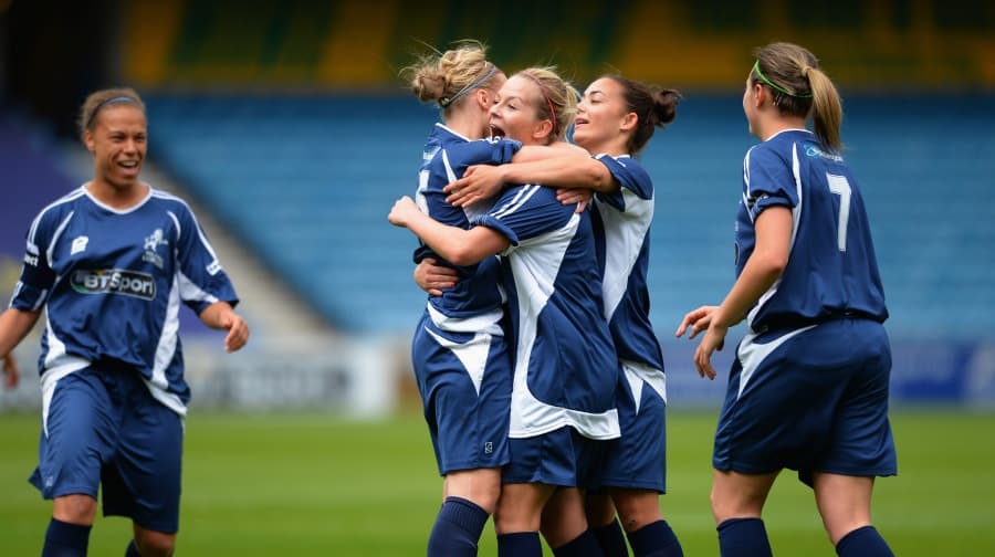 The Lionesses celebrate a goal.