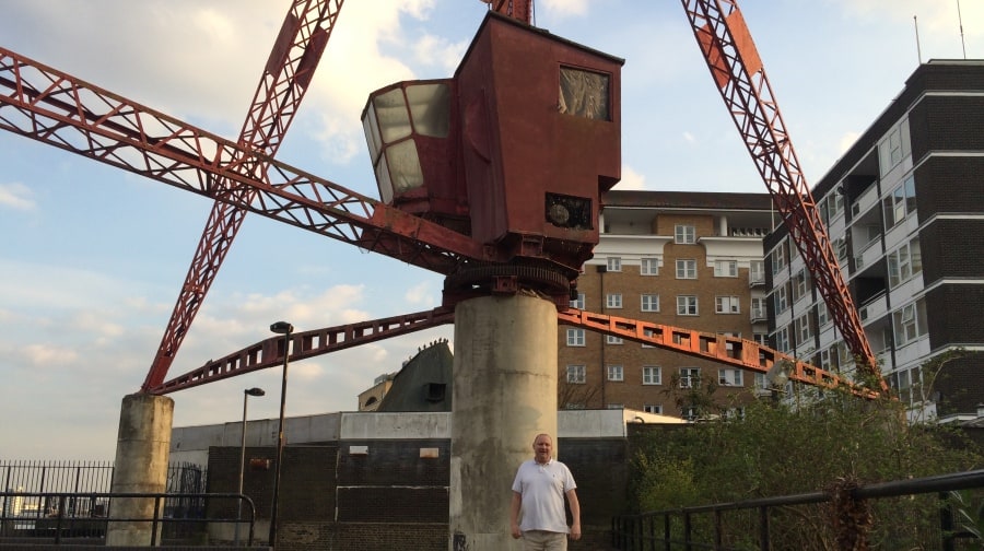 Local resident Ian Cooper in front of the beloved crane.