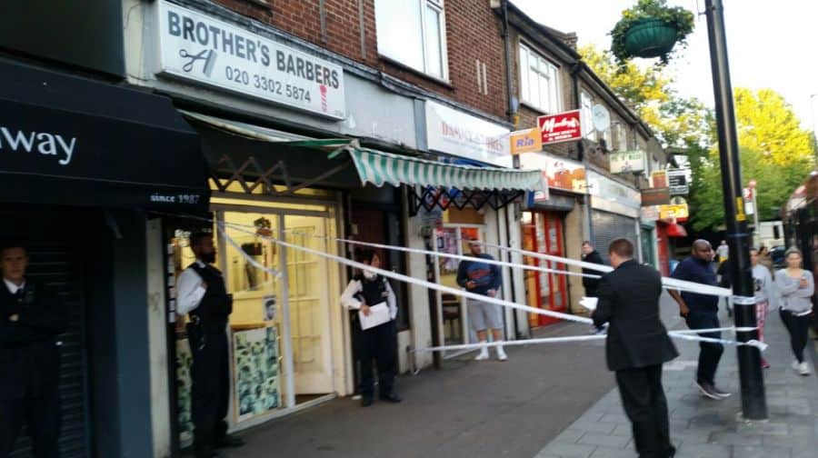 The scene outside Brother's Barbers in Southwark Park Road yesterday evening.