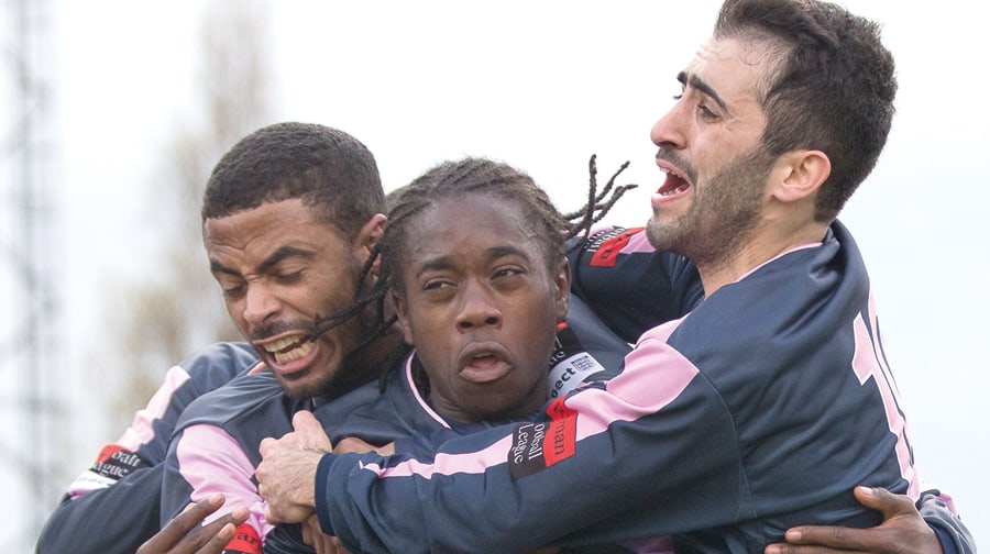Dulwich Hamlet's Ellis Green (left) & Erhun Oztumer (right), celebrate with goalscorer Xavier Vidal (centre)