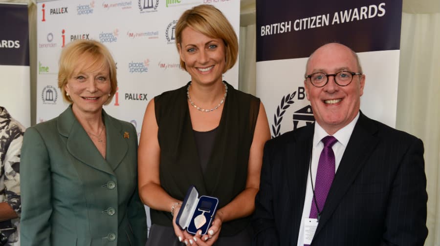 Elizabeth Parker (centre) receives her award