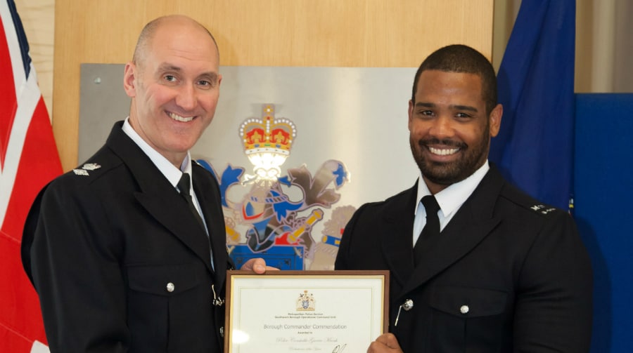 Police Constable Garrio Marsh receives the award from Borough Commander,  Zander Gibson