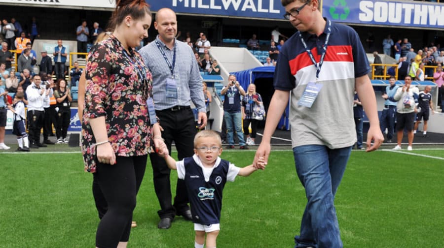 Harvey is led onto the pitch at the Chesterfield game