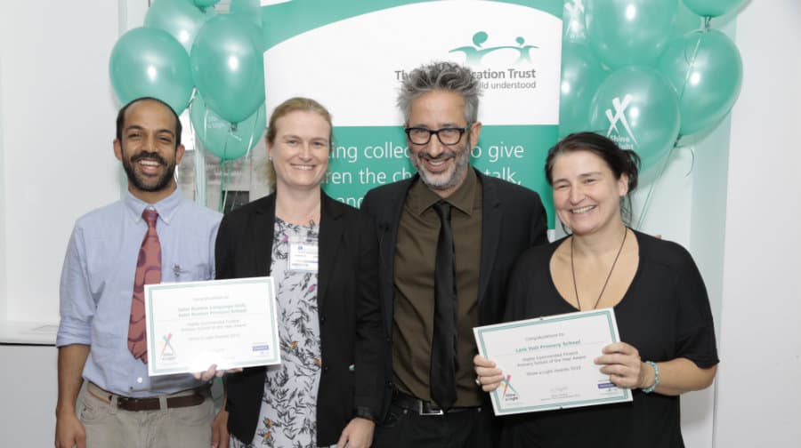 Baddiel with representatives from the school.