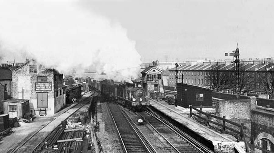 A goods train passing through Camberwell station in 1957, after it was closed to passengers some four decades earlier