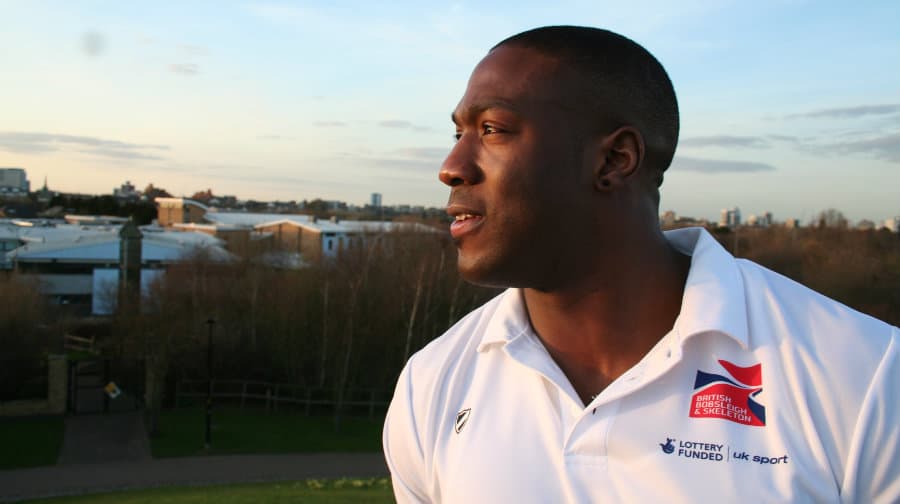 Toby Olubi outside Bacon's College