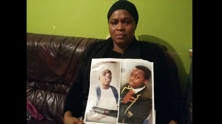 Mariama Kamara holds a photo of her late son Mo