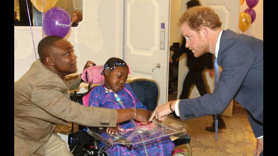 Myzat Mugomba and her dad Peter with Prince Harry