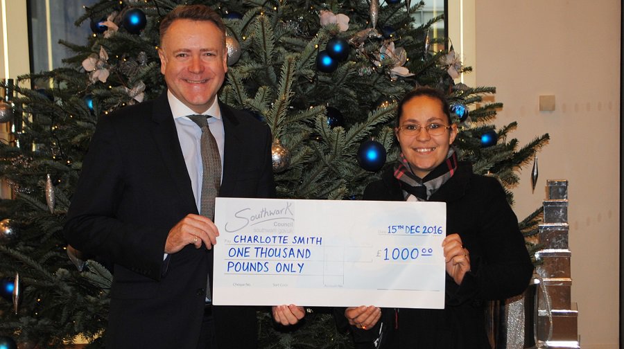Councillor Peter John hands prize to Charlotte Smith