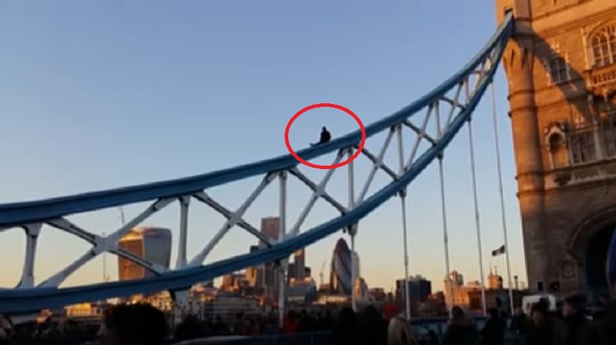 Police issued a warning to time-wasters after a video blogger climbed Tower Bridge in his latest stunt. Credit: Joe Deniable