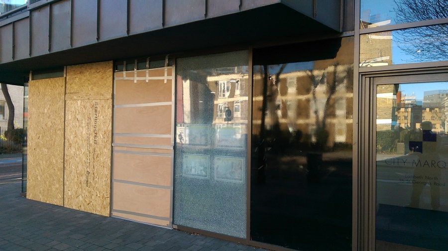 Police are appealing for information after windows belonging to London South Bank University and an estate agent were smashed