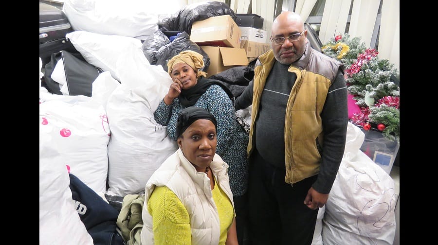 Sister Chatherine Msoni (back left) with Valerie Msoni and Nathan Msoni in their stock room at Thurlow Lodge