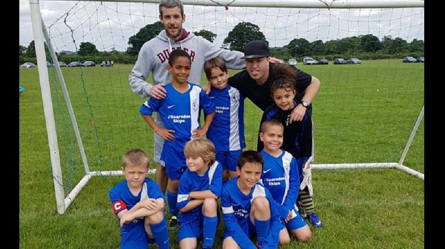 Team photo of Bruin JFC with coach, Peter Farrell (top right)