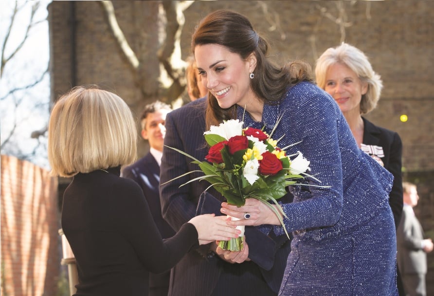 8-year-old Izzy presenting Duchess Kate with a posy