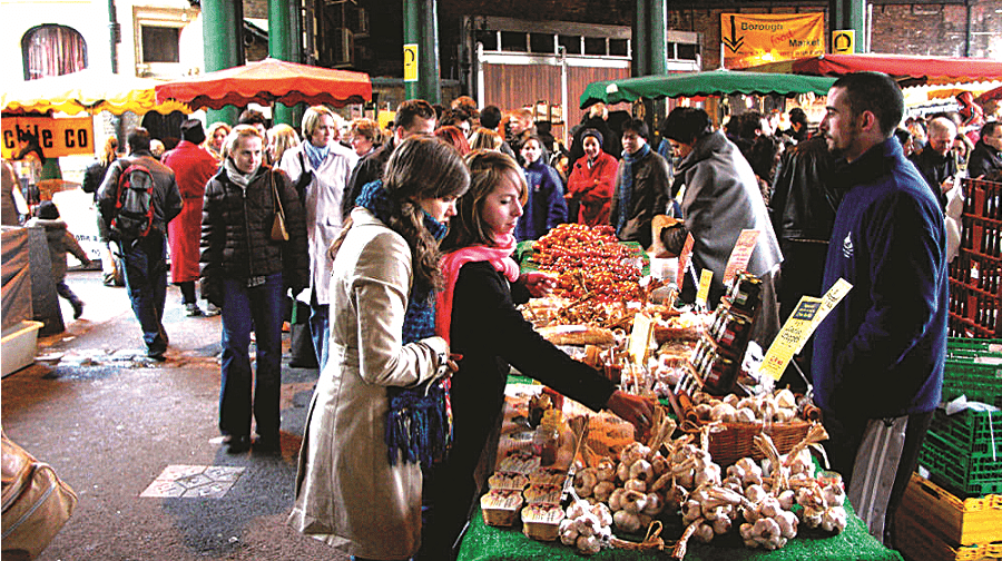 Customers pictured buying produce at Borough Market