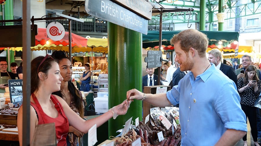 Prince Harry meets stall holders during a visit to Borough Market (Credit: Kensington Palace/ PA John Stillwell