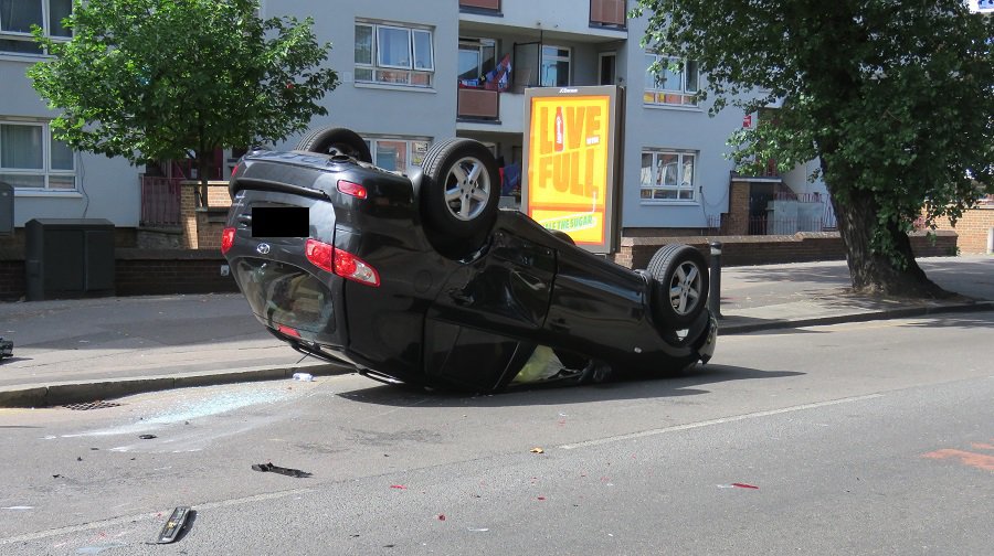 A car flipped onto its roof during a crash with another vehicle in Rotherhithe New Road (Credit: Alex Lambe)
