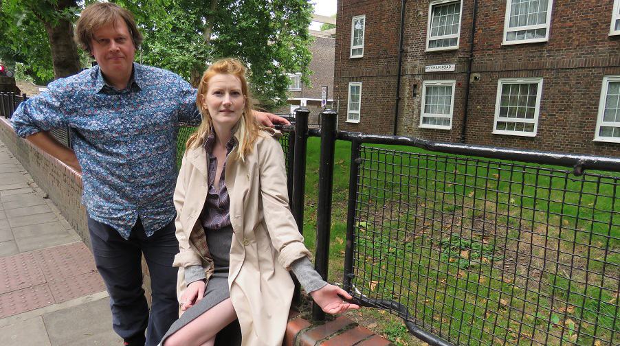 Benny O'Looney and Rosie Shaw beside row of stretcher fences in Peckham Road