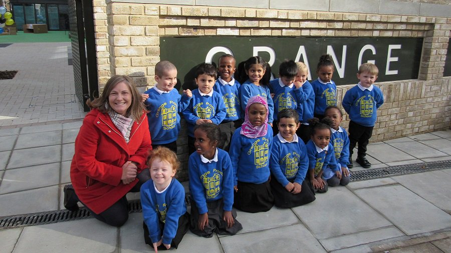 Cllr Victoria Mills, cabinet member for children and education, with pupils at Grange Primary School