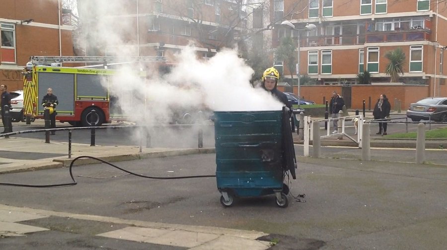 Firefighters put out a bin fire at Canada Estate, in Rotherhithe