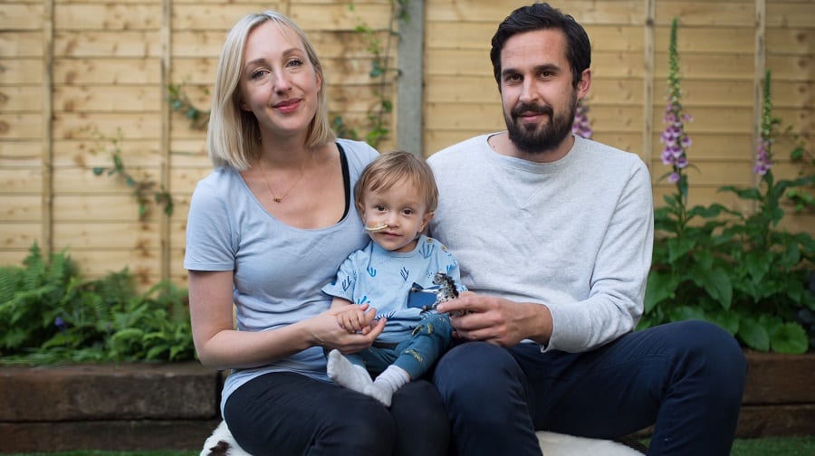 Emma Mayo and Jamie Mascaro with nineteen-month-old Teddy who has high-risk neuroblastoma