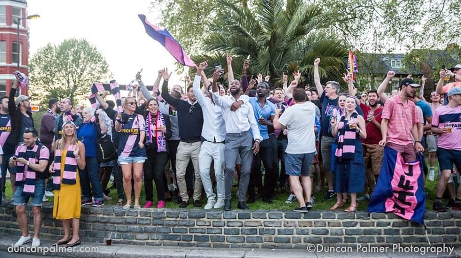 Dulwich Hamlet players and fans celebrating their historic promotion in May 2018. Image: Duncan Palmer Photography.