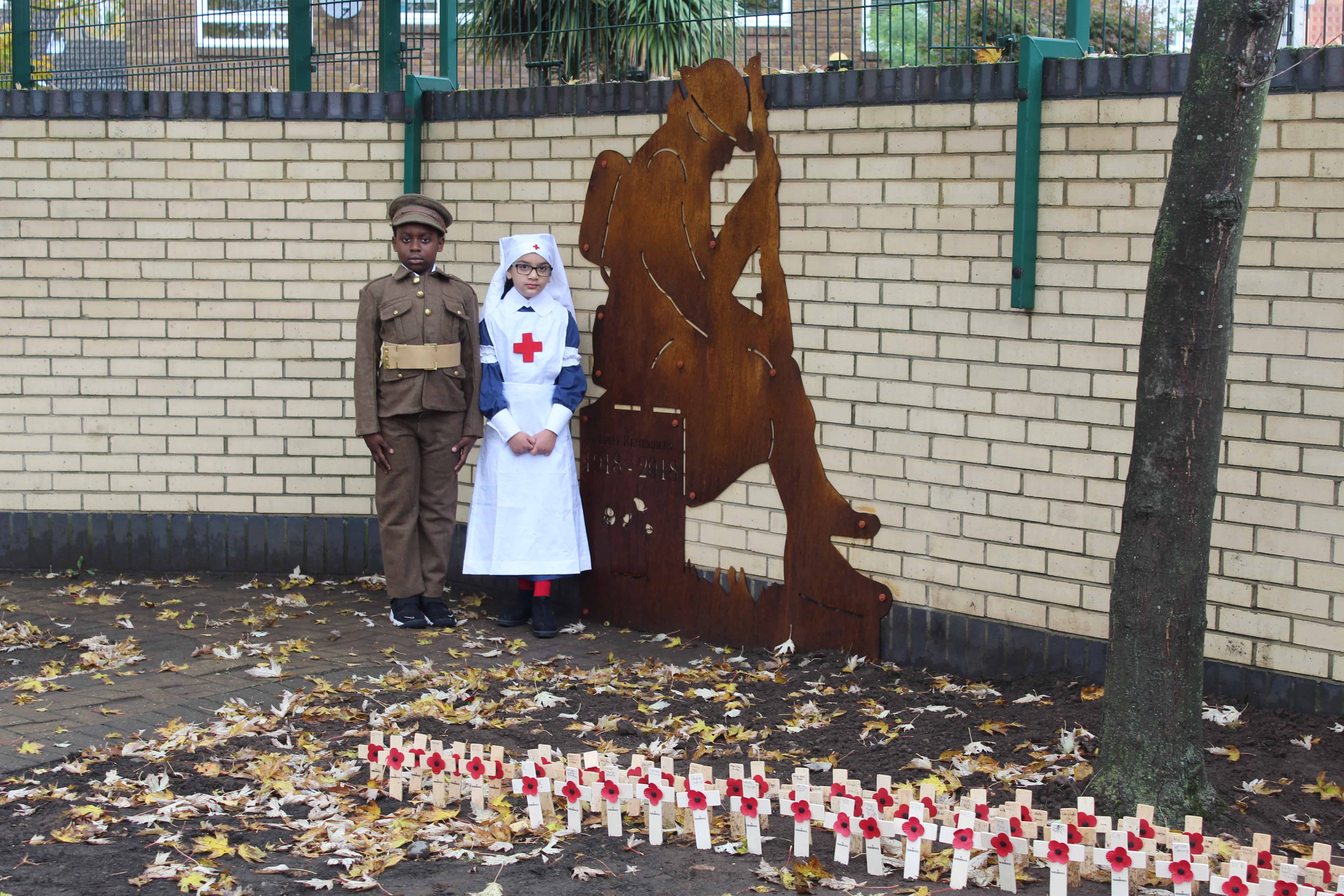 Two pupils at Redriff Primary in Rotherhithe at the unveiling of the memorial garden today