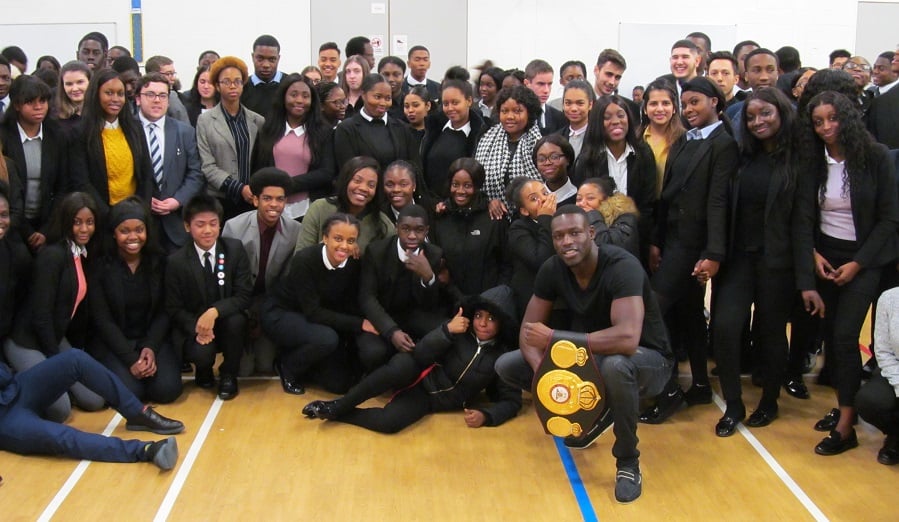 The boxer with students from his former school, Sacred Heart in Camberwell