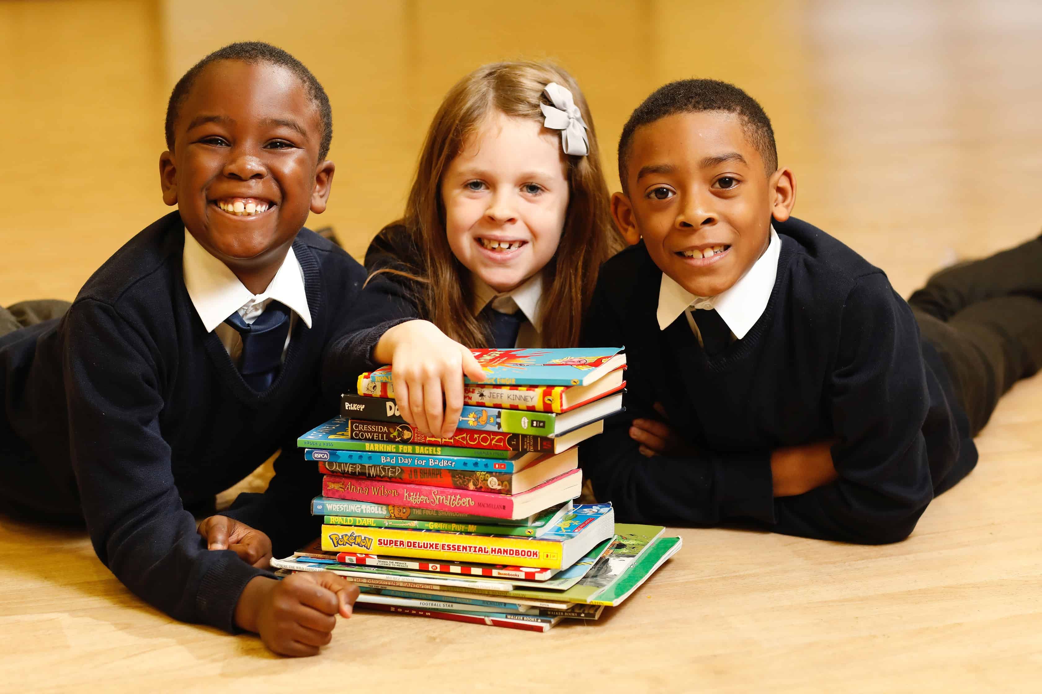 The donation to Peter Hills Primary School pupils (pictured) marks the 100,000th book giveaway