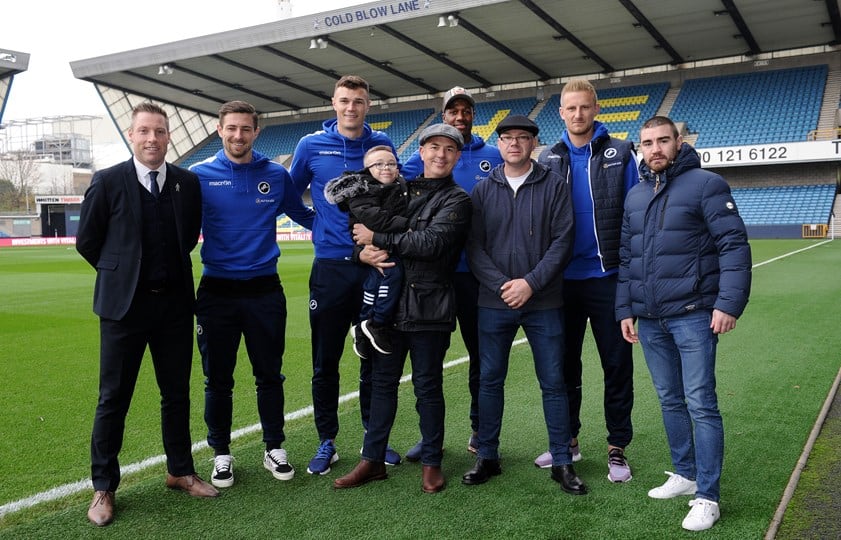 Steve, pictured with Harvey, dad Dean and members of Millwall FC