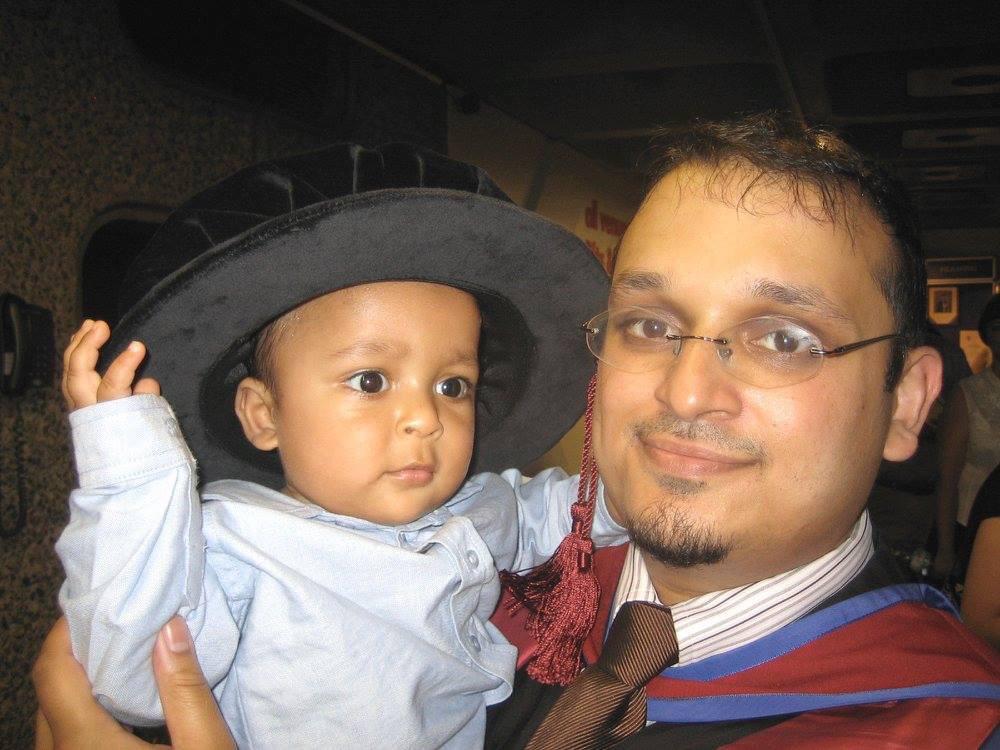 Zaki wearing hat with Alamgir