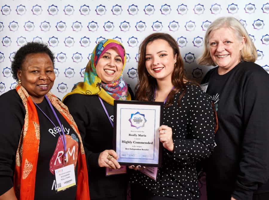Maria (centre left) and her team accepting the award earlier this year