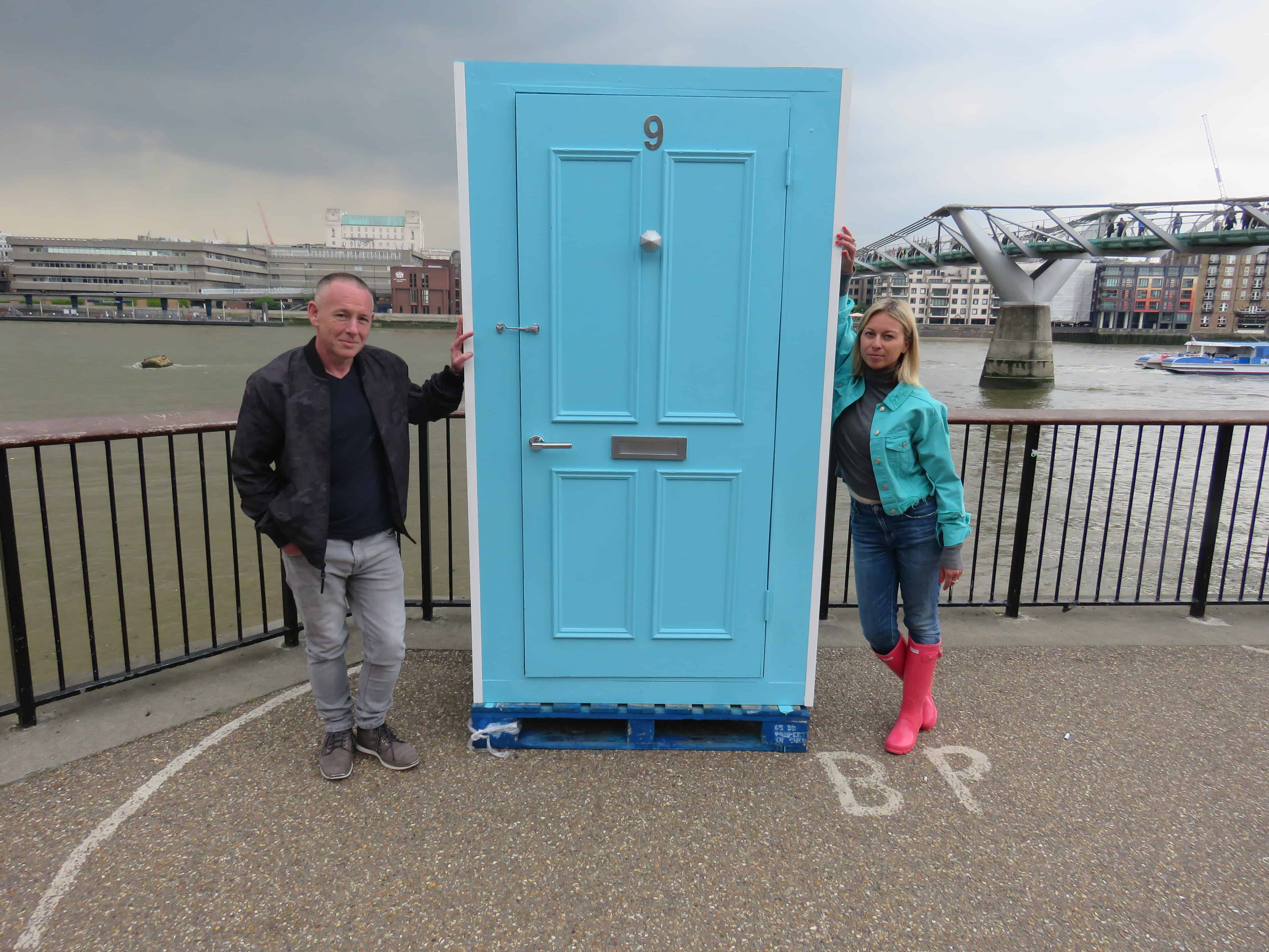 Paul Quigley, (L) and Nadia Filitova (R) next to their home-made 'Time Booth' which people can scream as loud as they like into