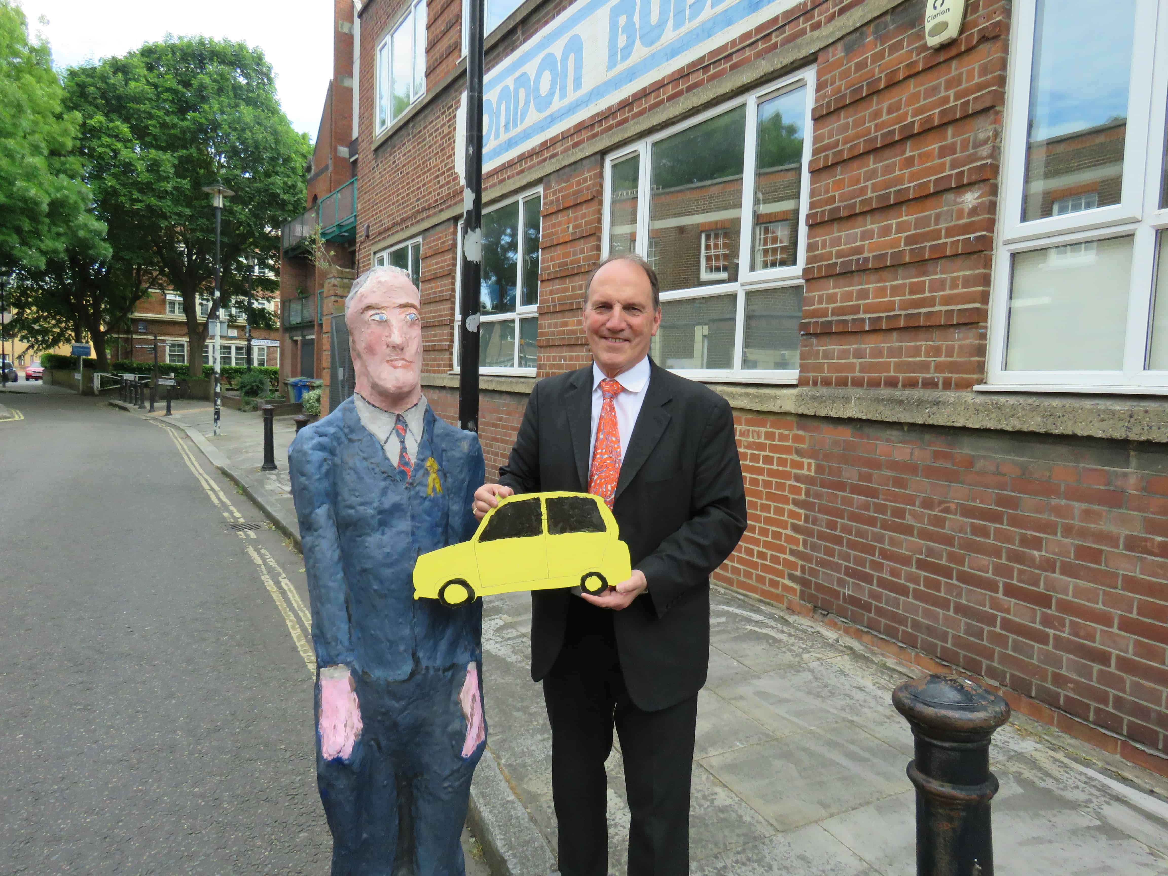 Sir Simon Hughes, pictured with his statue outside of the London Bubble Theatre Company