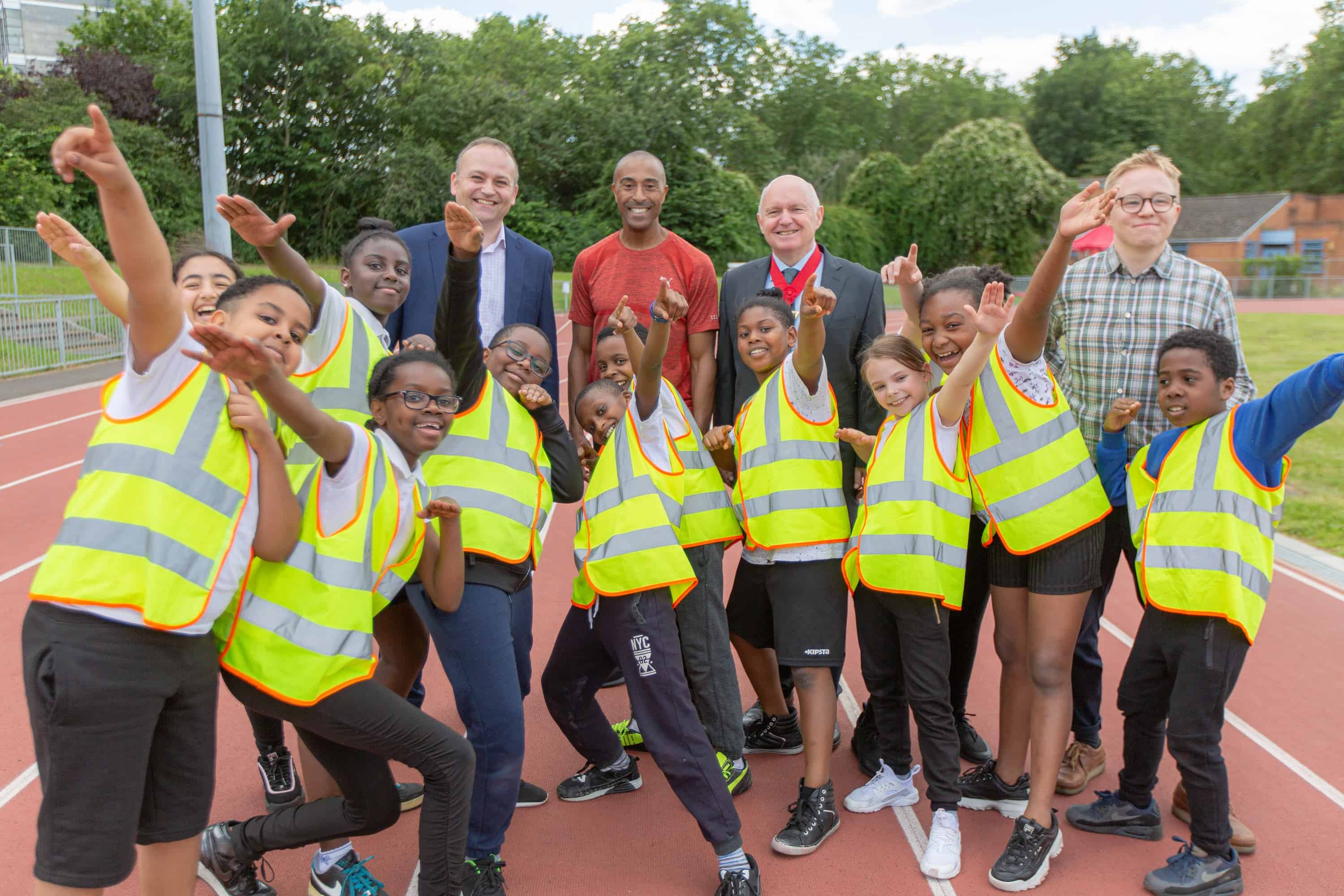 Children from Rotherhithe Primary School with MP Neil Coyle Colin Jackson and Cllr Barrie Hargrove