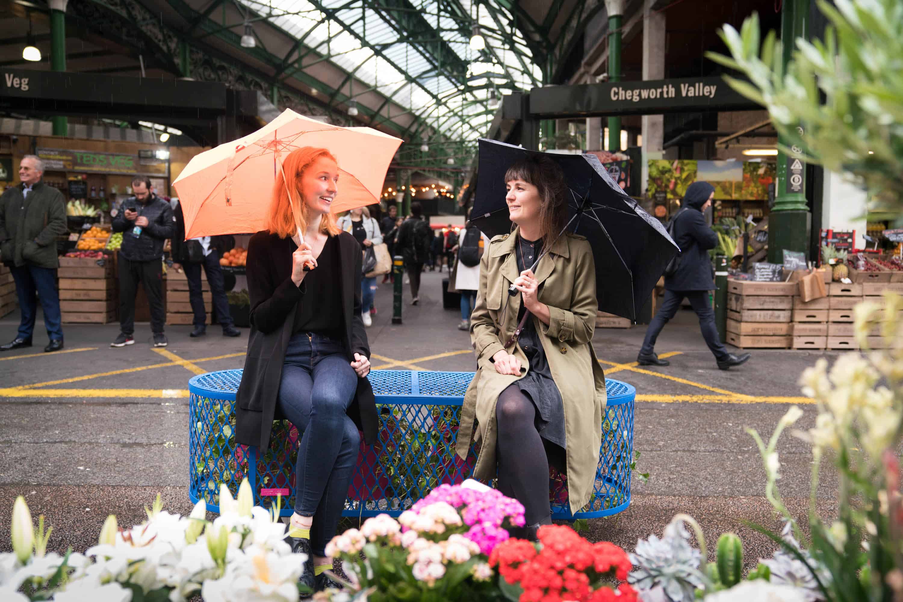 Two pedestrians pictured on one of the new Bankside 'better air' benches