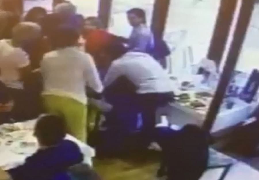 The moment Cem rushed to the diner's aid was caught on CCTV