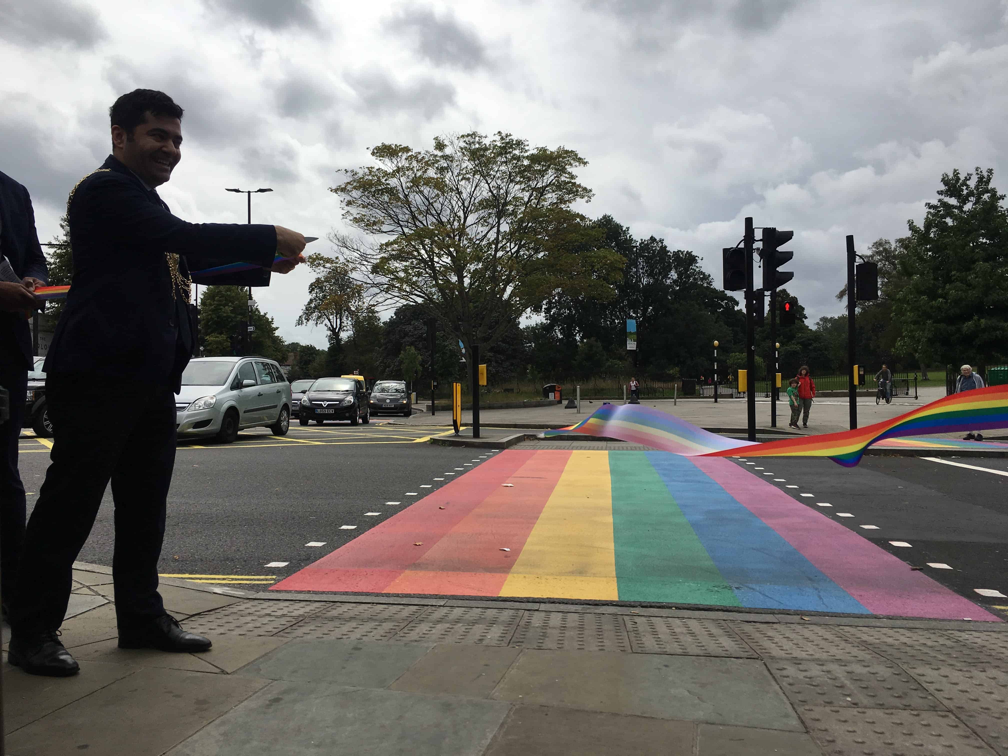 Lambeth's Cllr Ibrahim Dogus cutting the ribbon to the rainbow crossing