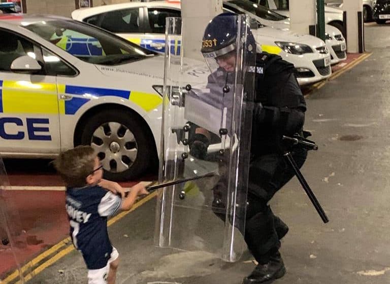 Little Harvey put riot police through their paces during the tour of a police station