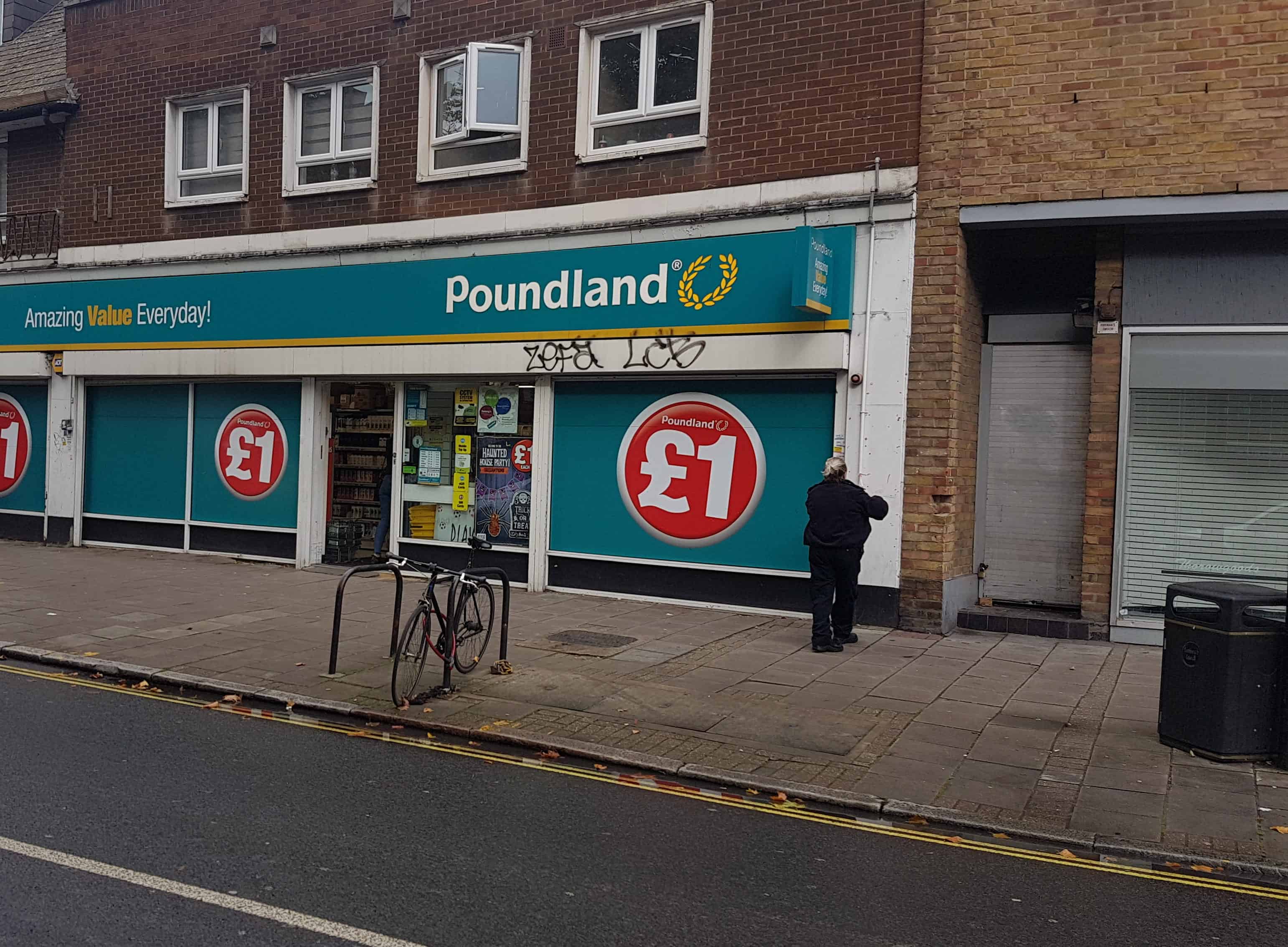 A police officer seen widening up the cordon after the bottling incident near Poundland this morning