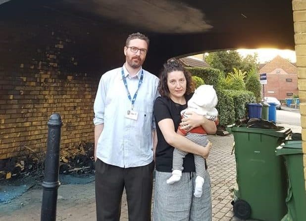 Couple George and Marialouisa pictured outside their burned flat