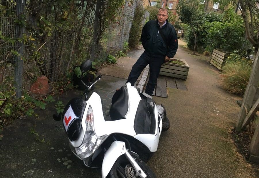 Grahm Neale with the recovered scooter