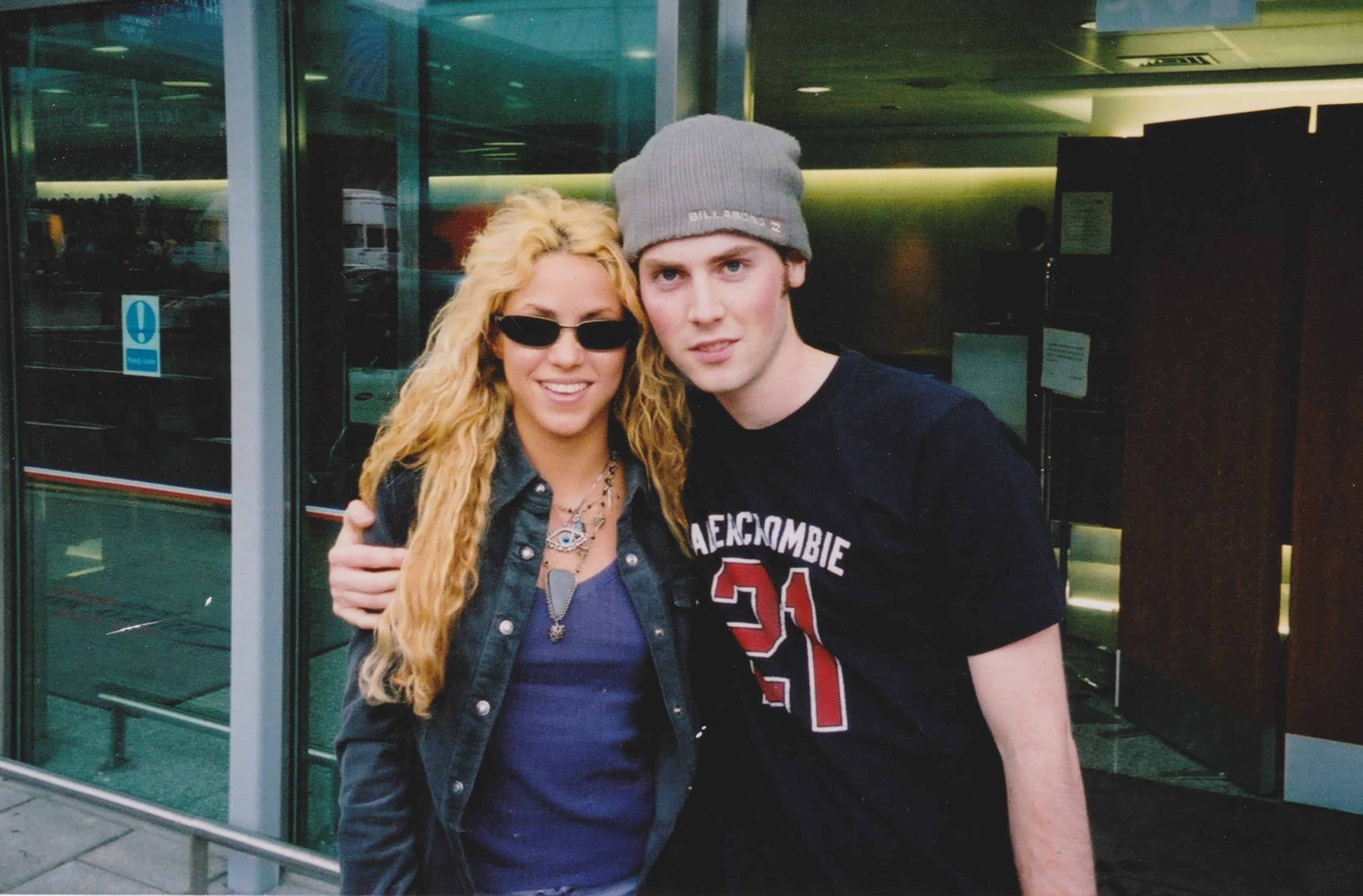 Malcolm and Shakira at the airport in 2002