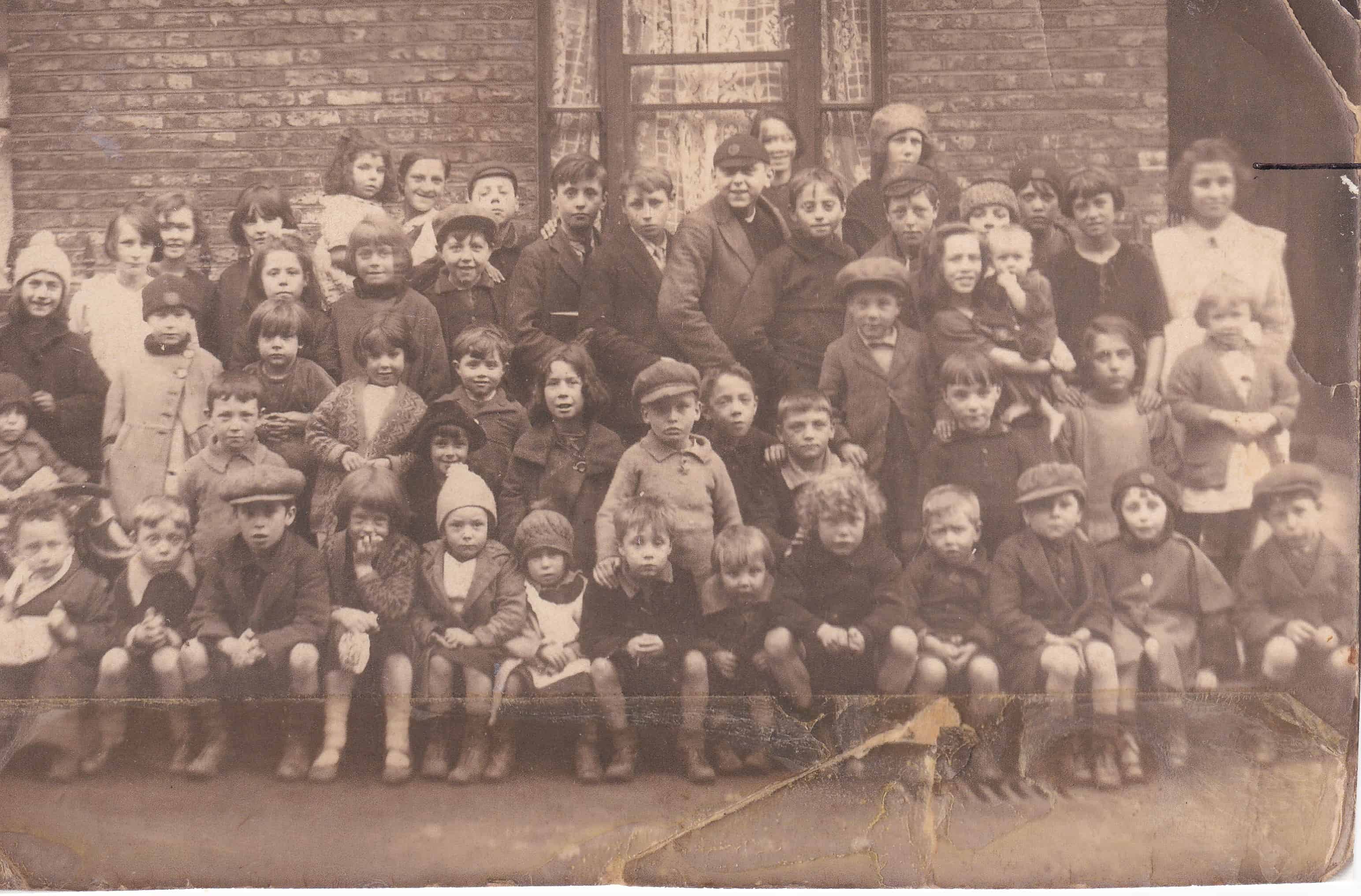 All the kids of Henshaw Street. Probably early 1930s. Rose is the one in the white, far right, back row.