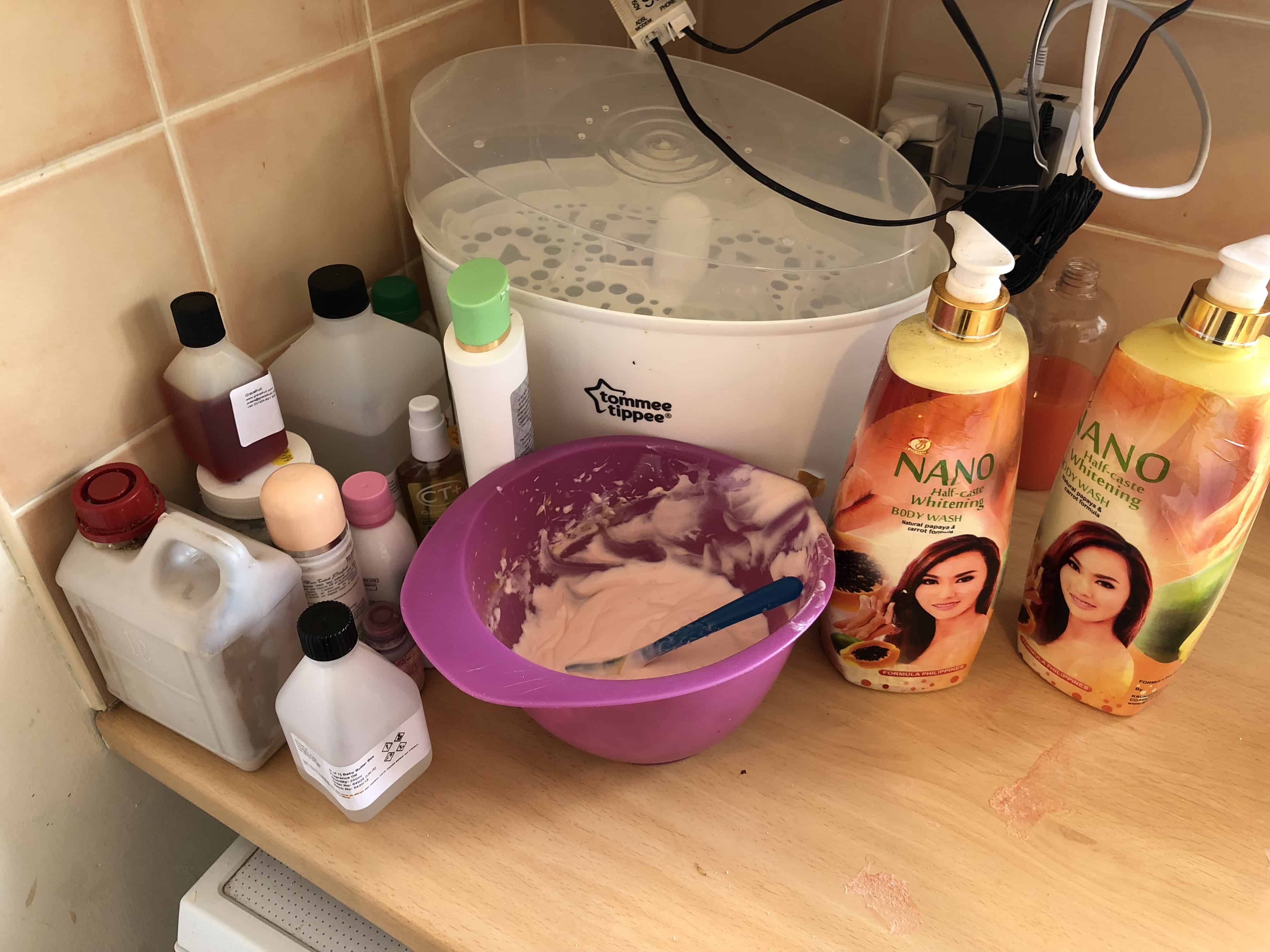 The couple were using a mixing bowl to concoct their banned skin bleaching products - which is pictured next to a baby bottle steriliser