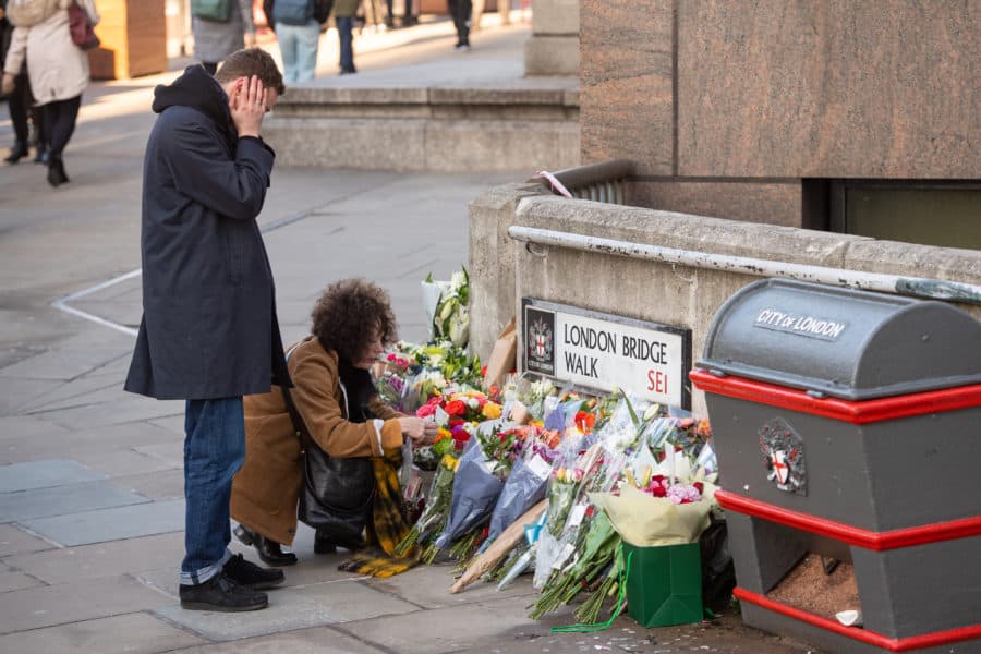 People lay flowers at London Bridge for the victims of the London Bridge terrorist attack. 

Dominic Lipinski/PA Wire.