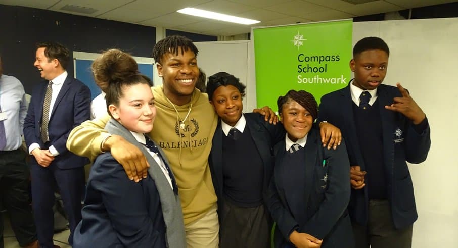 Star Ward actor John Boyega with Compass school pupils earlier this year. He says he wants to do more to support young people in Southwark.