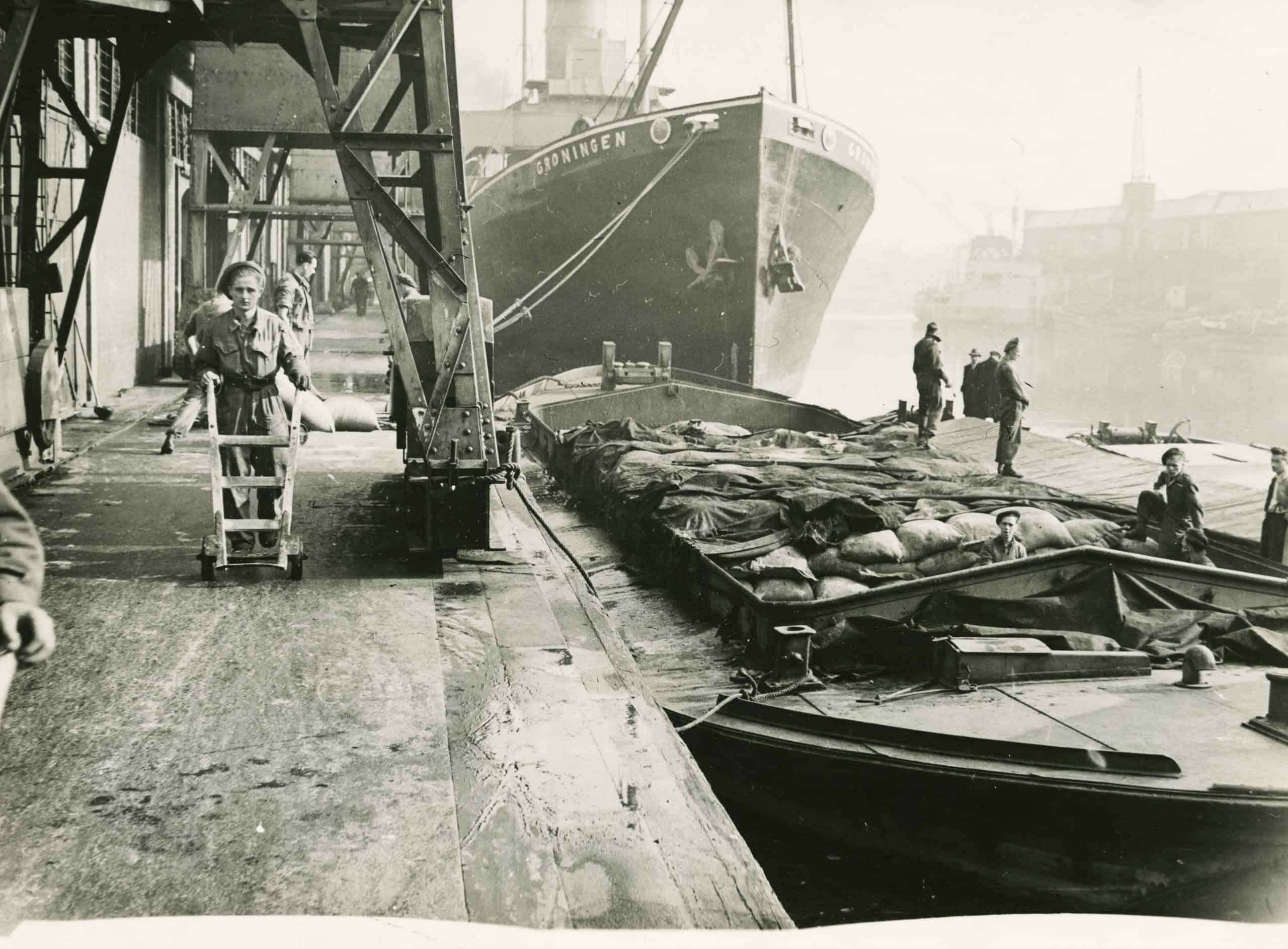 During a dock strike, millitary labour was called in to unload essential supplies. A grass-roots strike in October 1945 was not backed by union officials but port workers who had supported the war effort were determined to improve their working lives.