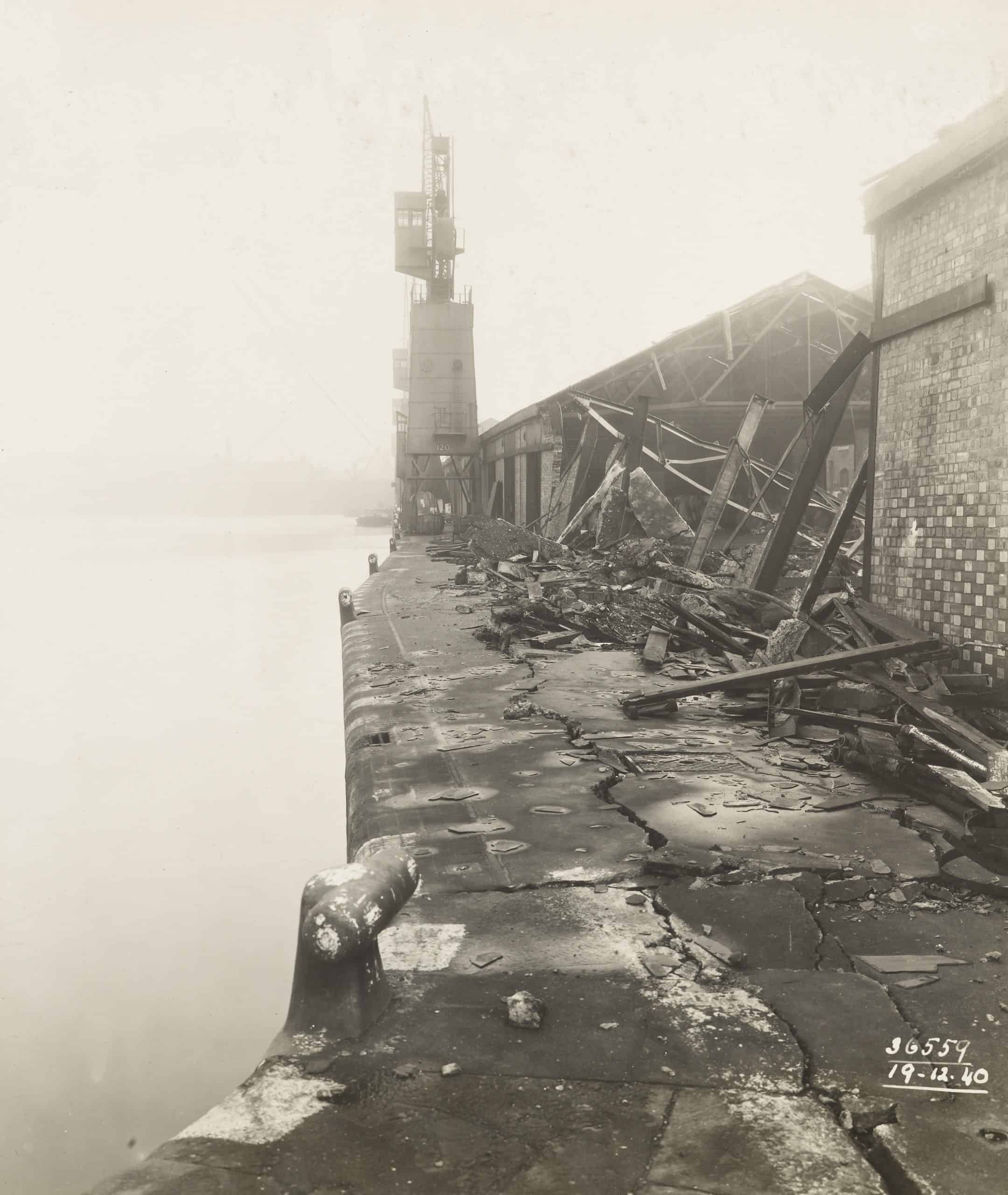 Bomb damage to London Dock. West End of Denmark Shed showing bulged quaywall of South Side of Western Dock.
Date: 19/12/1940
PLA Photo Number 36559