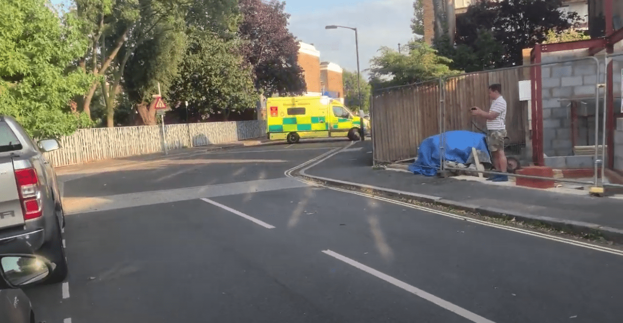 An ambulance appears to do a u-turn at roadblock in Walworth in September